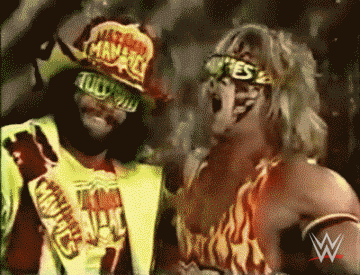 Sports gif. Macho Man and Randy Savage from WWE are standing together and roaring while giving us a thumbs up. 