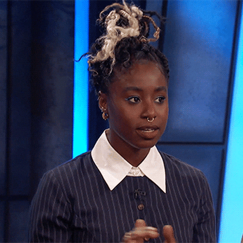 Celebrity gif. Kirby Howell-Baptiste folds her hands, glances up and rolls her eyes, shaking her head slightly.