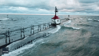 Waves Crash Against Lake Michigan Lighthouses