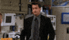 Friends gif. Matthew Perry as Chandler Bing doing a silly dance, hopping and waving his arms awkwardly.
