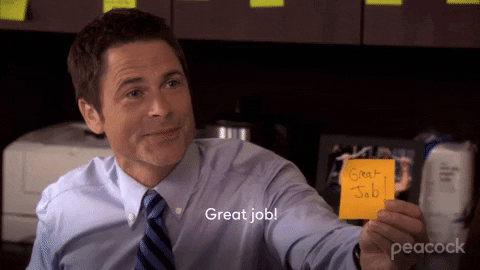 TV gif. Rob Lowe as Chris in Parks and Recreation speaks to someone excitedly as he raises a sticky note towards them. The note and text reads, "Great job!"