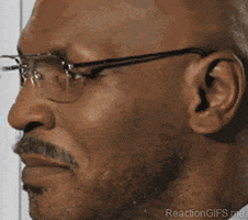 Celebrity gif. Mike Tyson slowly turns his head and looks straight at us. A smile crosses his faces and he nods lightly. 