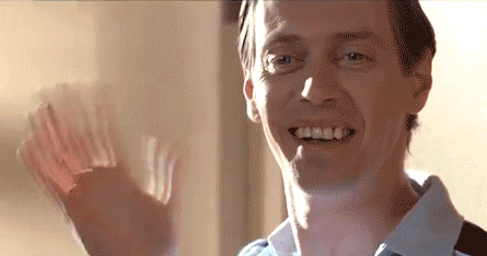 Movie gif. Steve Buscemi as Danny MacGrath in Billy Madison waves with a goofy smile. His eyes look to someone dreamily. 