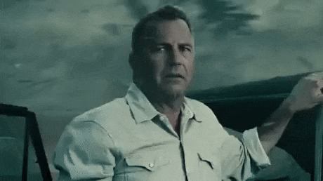 Movie gif. Kevin Costner as Jonathan Kent stands next to a car in the middle of a tornado. He holds out his hand to say stop and shakes his head. He has a slightly sorrowful look on his face. 
