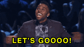 Reality TV gif. Jason Derulo is a judge on So You Think You Can Dance and he jumps out of his seat in excitement, looking up at the ceiling and roaring, "Let's go!" while the other judges jump up with him.