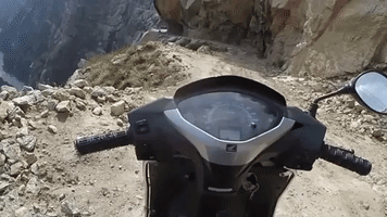 Man Rides Small Motorbike on the 'World's Most Dangerous Road'