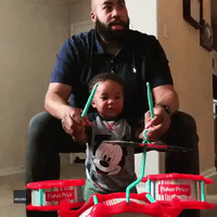 Toddler Can't Stop Laughing as He Plays Drums With Dad
