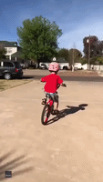 Five-Year-Old Shows Younger Brother How to Ride a Bike