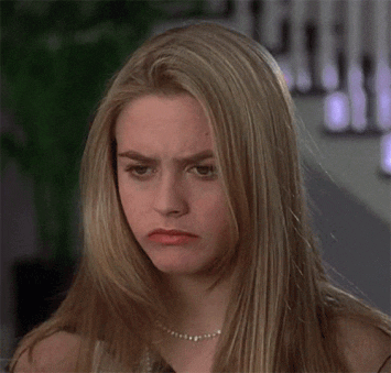 Movie gif. Alicia Silverstone as Cher in Clueless rolls her eyes and glances to the side in disgust. 