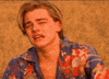 Movie gif. Leonardo DiCaprio as Romeo in Romeo + Juliet. He sits in a field during golden hour and is sobbing by himself. He chokes in air as he weeps and he is filled with anguish.