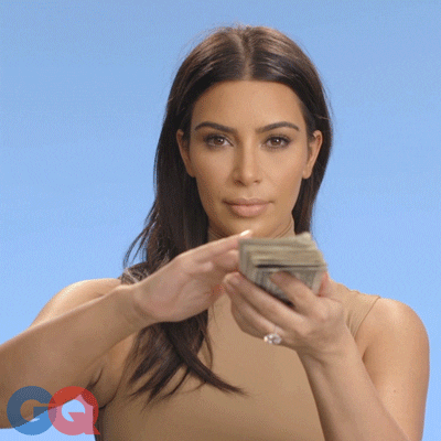Celebrity gif. Kim Kardashian is seated against a blue background, sliding bills into the air from a stack of cash in her hands. Text, Cash monaaaaaaaay.