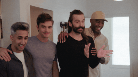 TV gif. Queer Eye. From left to right, Tan France, Antoni Porowski, Jonathan Van Ness and Karamo Brown stand, side by side with arms around each other, some smiling and clapping encouragingly.