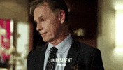 the resident smile GIF