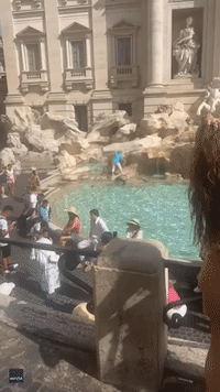 Woman Walks Across Trevi Fountain to Fill Water Bottle