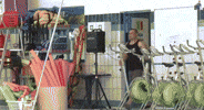 Video gif. Man enters the room to look in an empty indoor swimming pool that has a red stuffed fish flopping around in it. The man stands there with his hands on his hips, confused. He then turns around and leaves.
