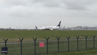 Sparks Shoot From RyanAir Plane as it Lands at Dublin International Airport