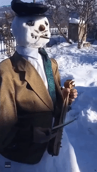 The Greatest Snowman? Cigar-Smoking Snowman Performs in Greece