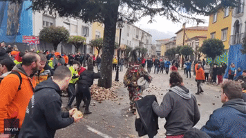 Crowd Throws Turnips at 'Jarramplas' Character During Traditional Spanish Festival