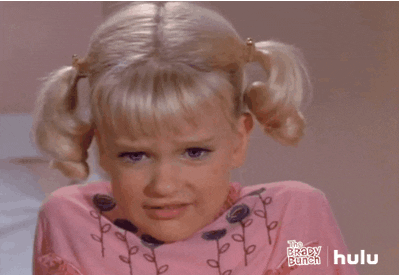 TV gif. Susan Olsen as Cindy Brady on The Brady Bunch sits up in bed and nods her head side to side, and moves her eyes around like she’s dizzy.