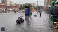 Heavy Rainfall Submerges New York Street and Floods Subway Station