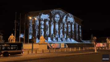 Singer's Portrait Projected Onto French National Assembly Amid Olympics Row