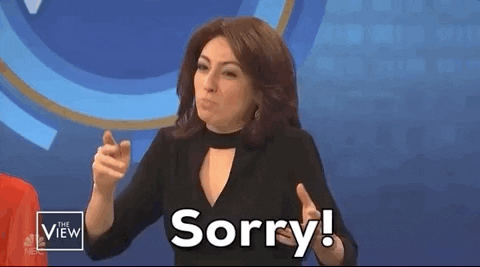 SNL gif. Melissa Villasenor throws her hands in the air and says dramatically, “Sorry!”