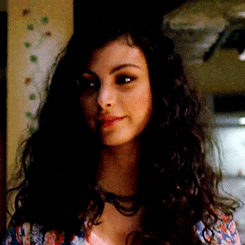 TV gif. Morena Baccarin as Inara Serra on Firefly gives a slow, but warm smile at someone off screen. 