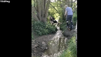 Man Tries to Jump Small Stream on Unicycle Again