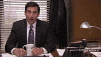 The Office gif. Steve Carrell as Michael Scott opens his mouth and eyes wide in shock, blinking as the camera zooms in.