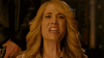 Movie gif. Kristen Wiig as Vicki in MacGruber shakes her head as she scrunches up her face in terror and screams, "No!" 