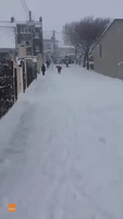 Irish Neighbours Snowboard the Streets of Tramore During Storm Emma