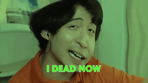 Celebrity gif. Nigel Ng’s face is distorted and under a green filter. He looks at us with a smug, sauce expression as he says, “I dead now.” 