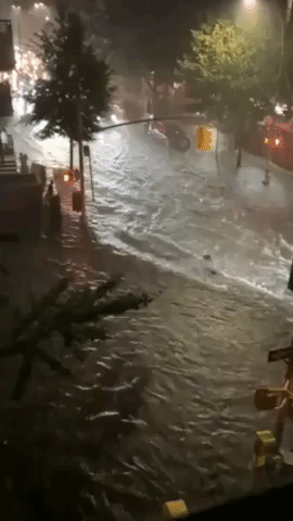 New York Streets Flooded After State of Emergency Declared Due To Hurricane Henri