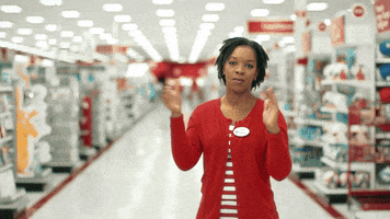 Video gif. A target employee stands in the middle of the store, giving a slow clap while staring at us. A man joins her to her right and claps, nodding his head in approval. Another man stands next to her, clapping as well with a big smile on his face. A woman pops up from below and joins their applause.
