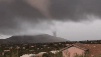 Funnel Cloud Tosses Debris in Arizona's New River Amid Tornado Warning