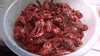 Video gif. We hover over a bowl full of steaming crawfish, ready to eat.