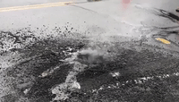 Lightning Bolt Forms Crater on Pavement During Storm in Hatfield, Massachusetts
