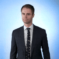 Celebrity gif. Michael Torpey gestures to pull something out of his coat pocket, then pulls out his hand, giving us a thumbs up.