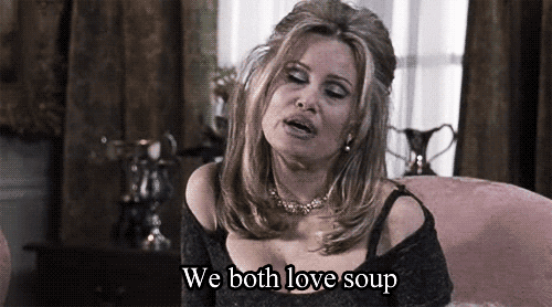 Movie gif. A dolled-up Jennifer Coolidge as Sherri in Best in Show smiles and says, “We both love soup.”