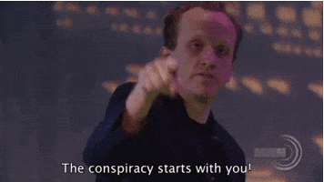 TV gif. From Conspiracy Theory Gary Show, Chris Gethard points at us and says, "The conspiracy starts with you!" which appears as text.