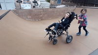 Sister and Wheelchair-Using Brother Try to Catch S