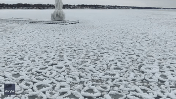 Lake Michigan Lighthouse Caked in Ice Following Blizzard Conditions