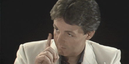 Celebrity gif. Paul McCartney looks to the side with seriousness and waggles his finger at someone. Text, "You got this."