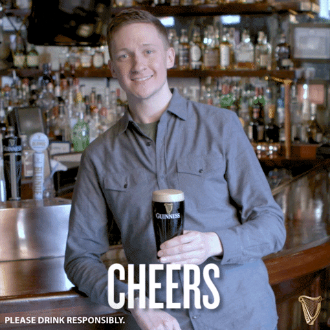 Ad gif. Man leans on his elbow against a bar and raises a pint of Guinness toward us to cheers. Text, "Cheers. Please drink responsibly."