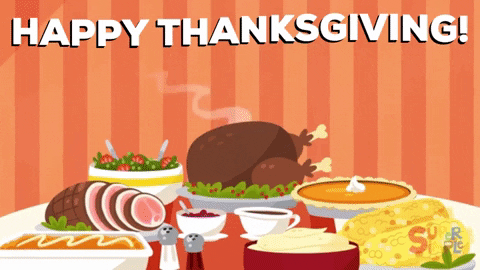 Cartoon gif. A Thanksgiving feast that includes turkey, ham, pumpkin pie, mash potatoes. A cartoon white cat and black cat pop up to look at the food with excitement, holding silverware up in the air like they are ready to eat. The white cat pops up closer and waves happily. Text, “Happy Thanksgiving!”