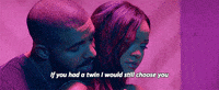 Music video gif. From the video for Work, Drake whispers into Rihanna's ear from behind as they dance beneath blue and pink lighting, singing, "If you had a twin I would still choose you," which appears as text.