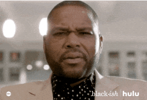 TV gif. Anthony Anderson as Andre in Blackish stares down at us, eyebrows furrowed as he slowly mouths the word, "Damn."