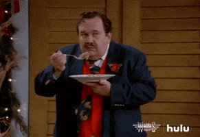 TV gif. David Schramm as Roy in Wings. He holds a fork full of food up to his mouth but gets nervous as he looks around the room and his hand begins to shake, dropping all the food back on to his plate.