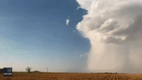 Enormous Supercell Towers Over Texas Wind Farm