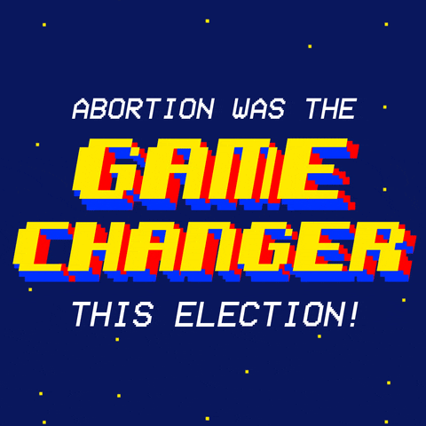 Text gif. 16-bit 3D letters on a starry background, red and blue on the Z-axis flashing white and yellow on the surface, reading "Abortion was the game changer this election!"